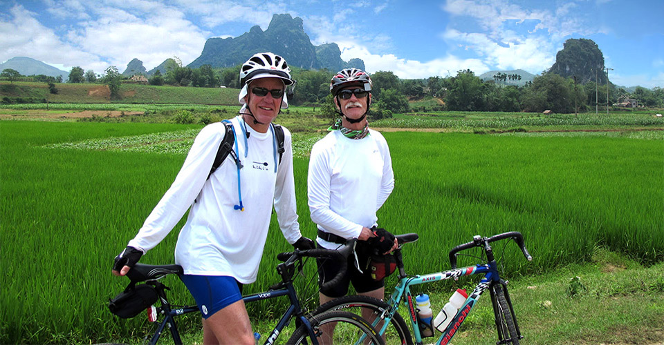 Bicycle touring through countryside landscapes in Asia